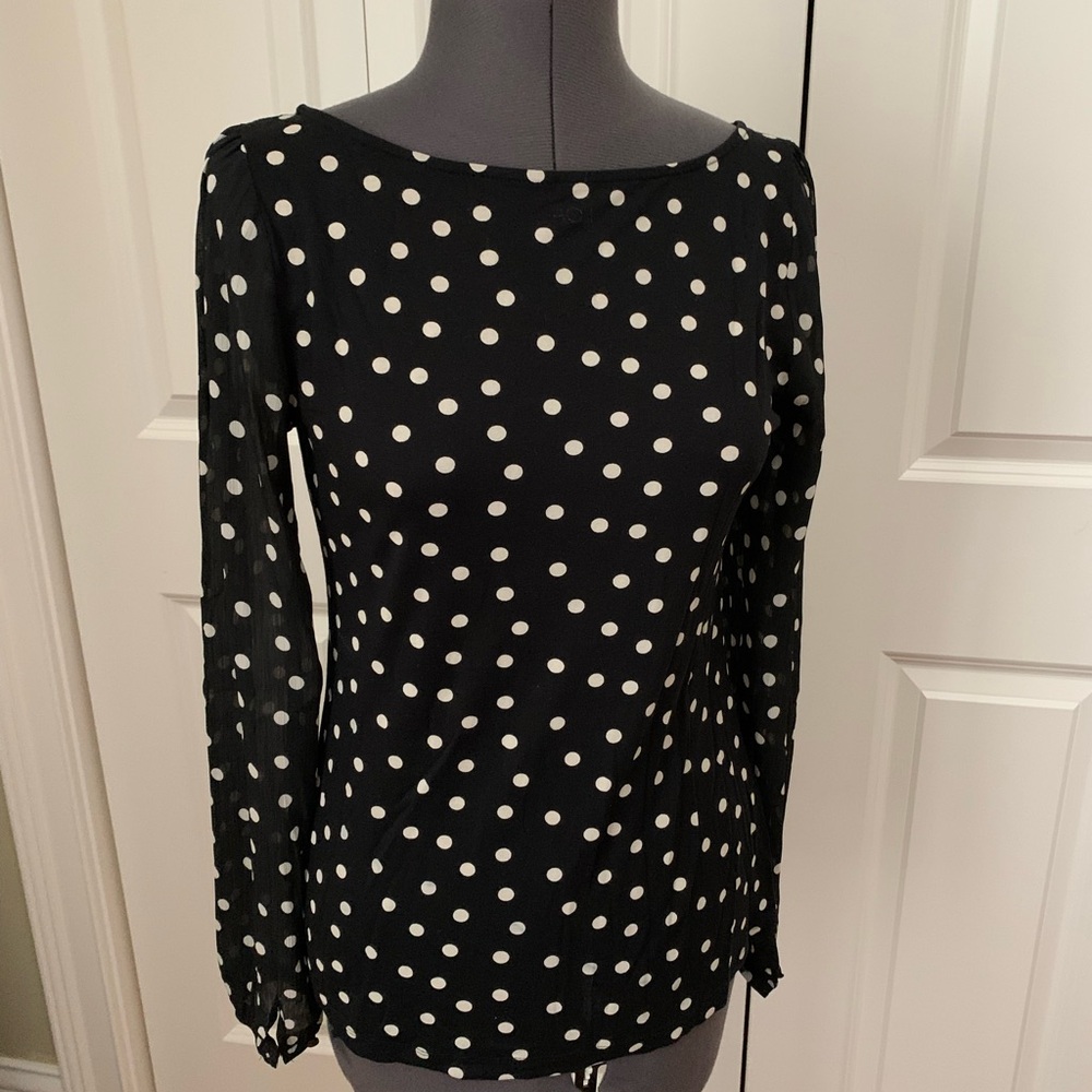 Scoop neck jersey top with semi sheer sleeves.